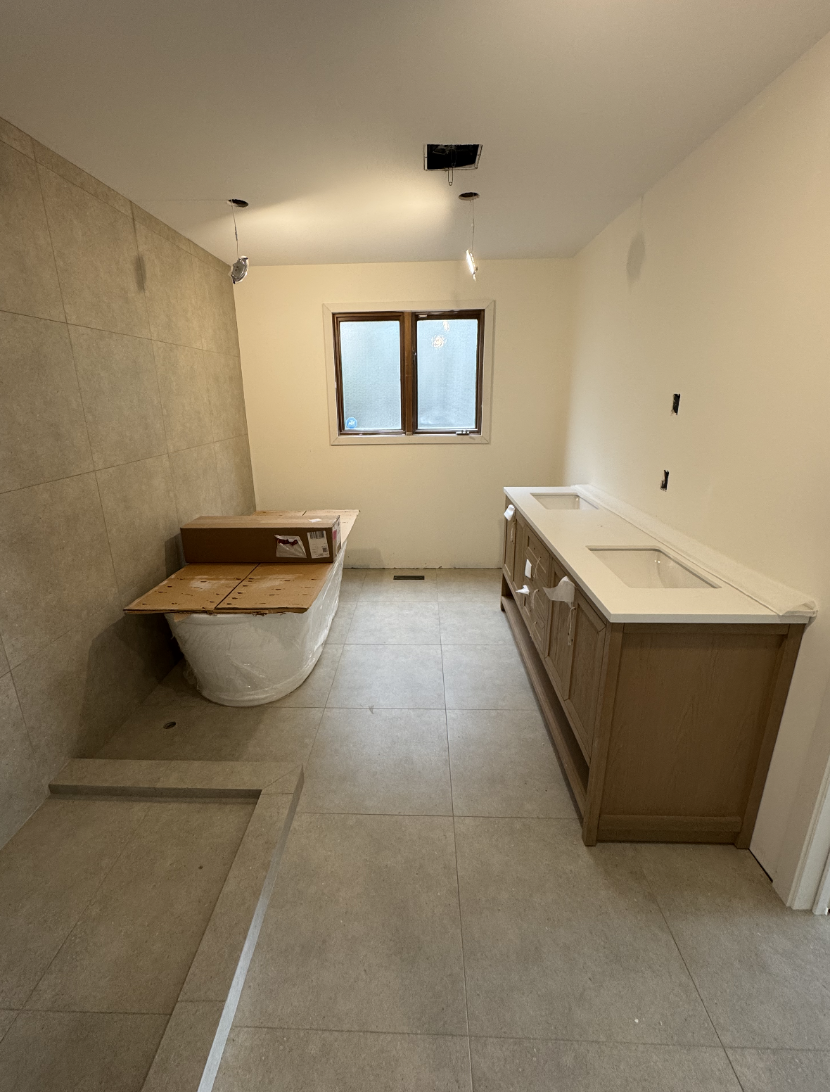 Bathroom tile installation during renovation in Kelowna