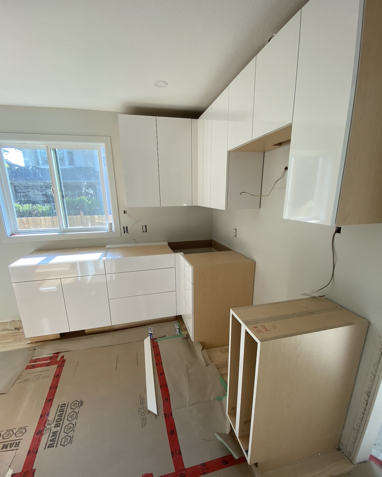 Kitchen cabinet installation during renovation in Kelowna