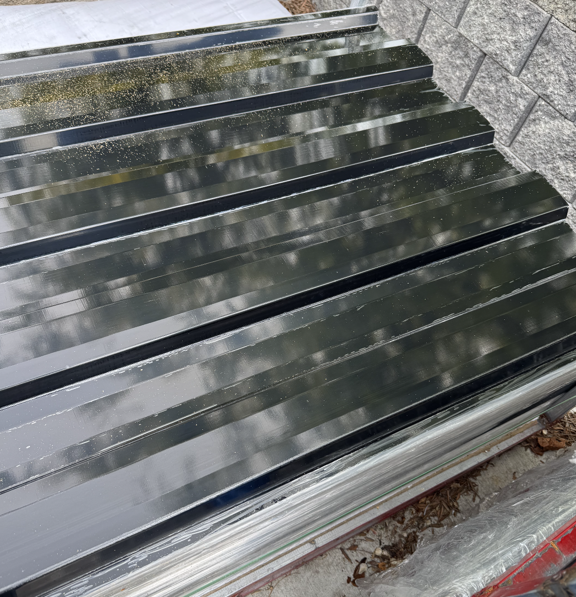 Corrugated metal fence installation in Kelowna by CedarWolf Build + Design