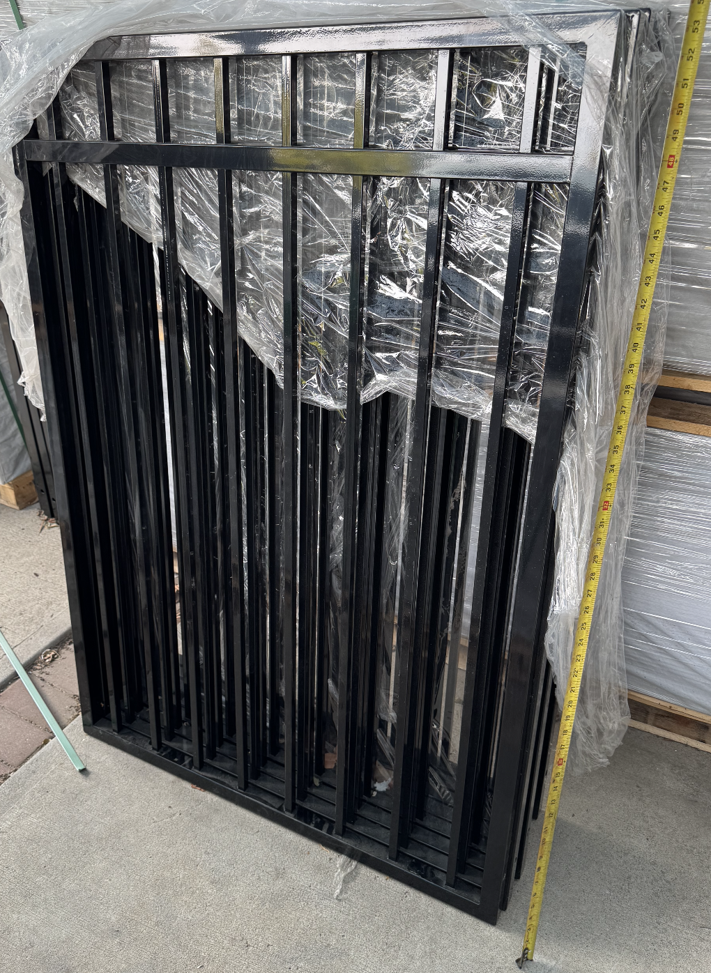 Metal gate installation in Kelowna by CedarWolf Build + Design