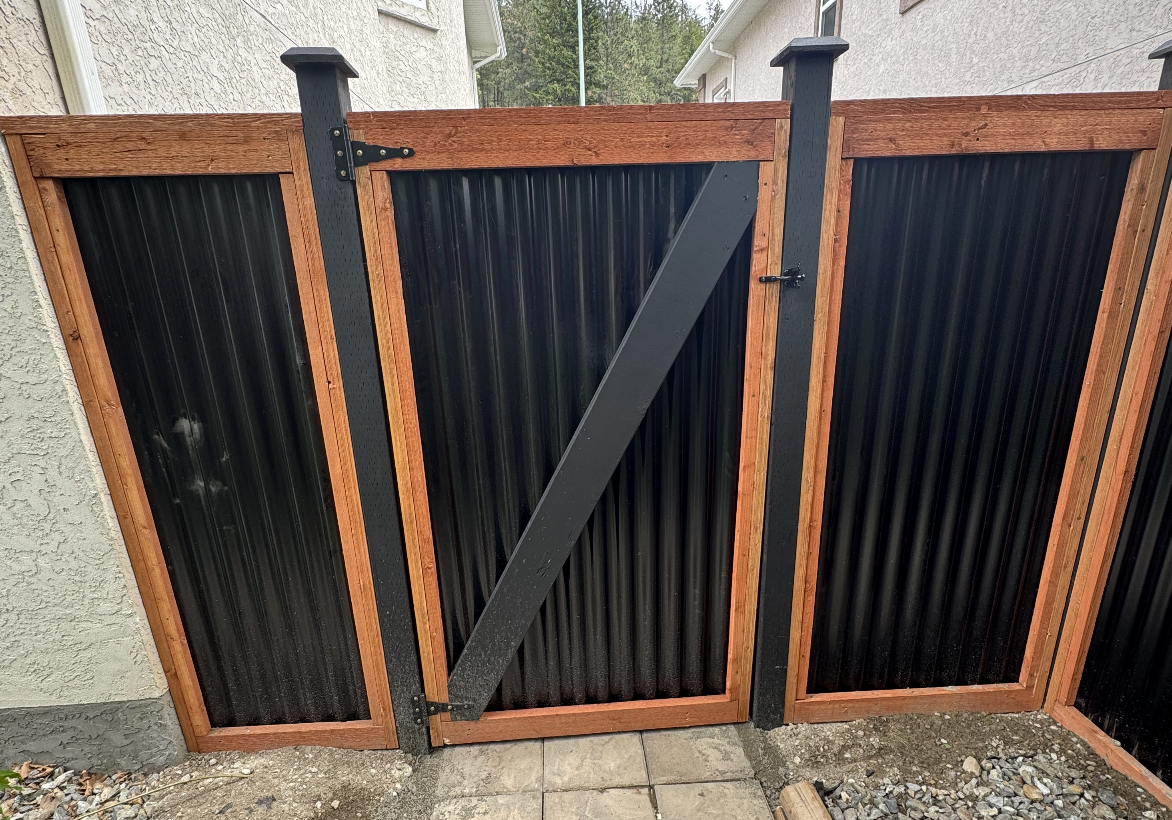 Metal panel fence and gate in Kelowna by CedarWolf Build + Design