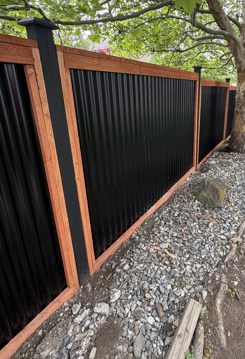 Modern metal panel fence in Kelowna by CedarWolf Build + Design