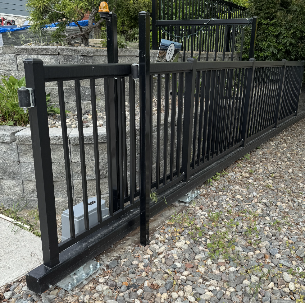 Sliding driveway gate in Kelowna by CedarWolf Build + Design