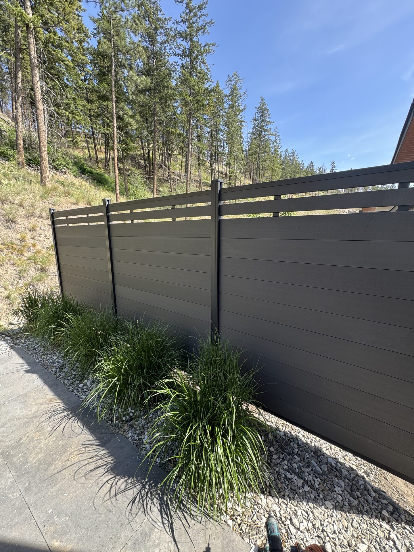 Modern composite fence project by CedarWolf Build + Design